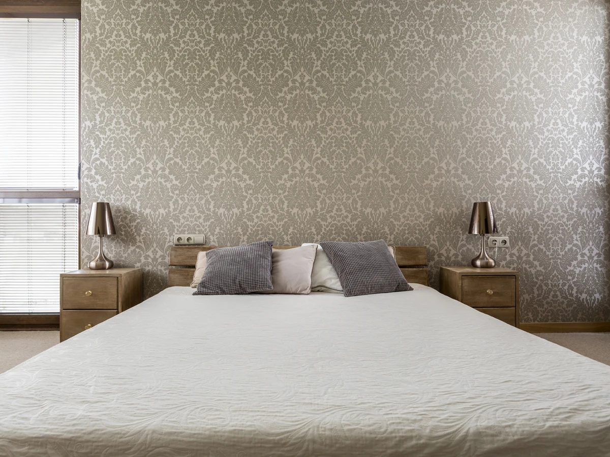 King-size bedroom with gold accents painted in Hereford by Hereford Painters