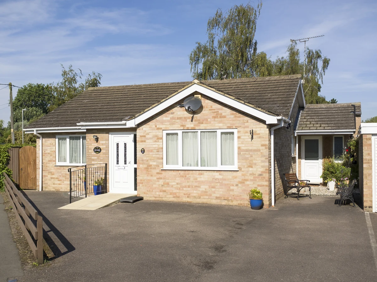 Brick bungalow exterior masonry painting in Hereford by Hereford Painters