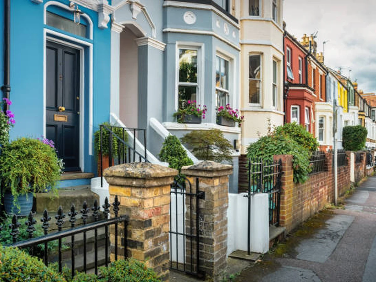 Colourful terraced houses with masonry painting in Hereford by Hereford Painters