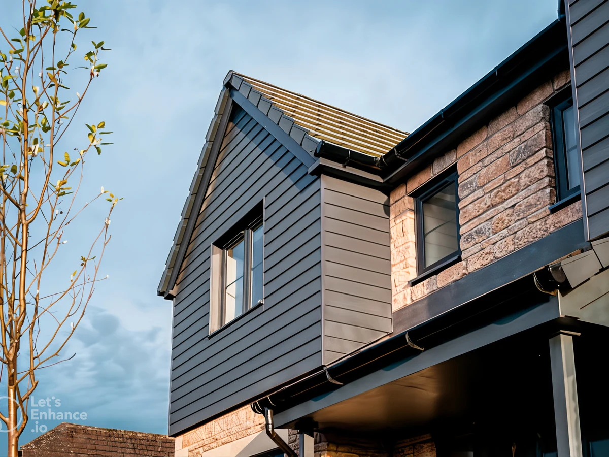 Exterior painting on a modern dark-coloured house by Hereford Painters
