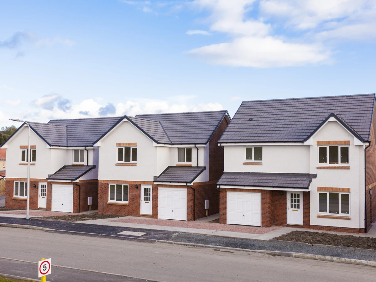 Exterior painting of a row of new detached houses in Hereford by Hereford Painters