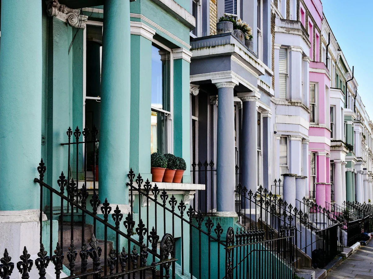 Front door painting on a teal and pink period property in Hereford by Hereford Painters