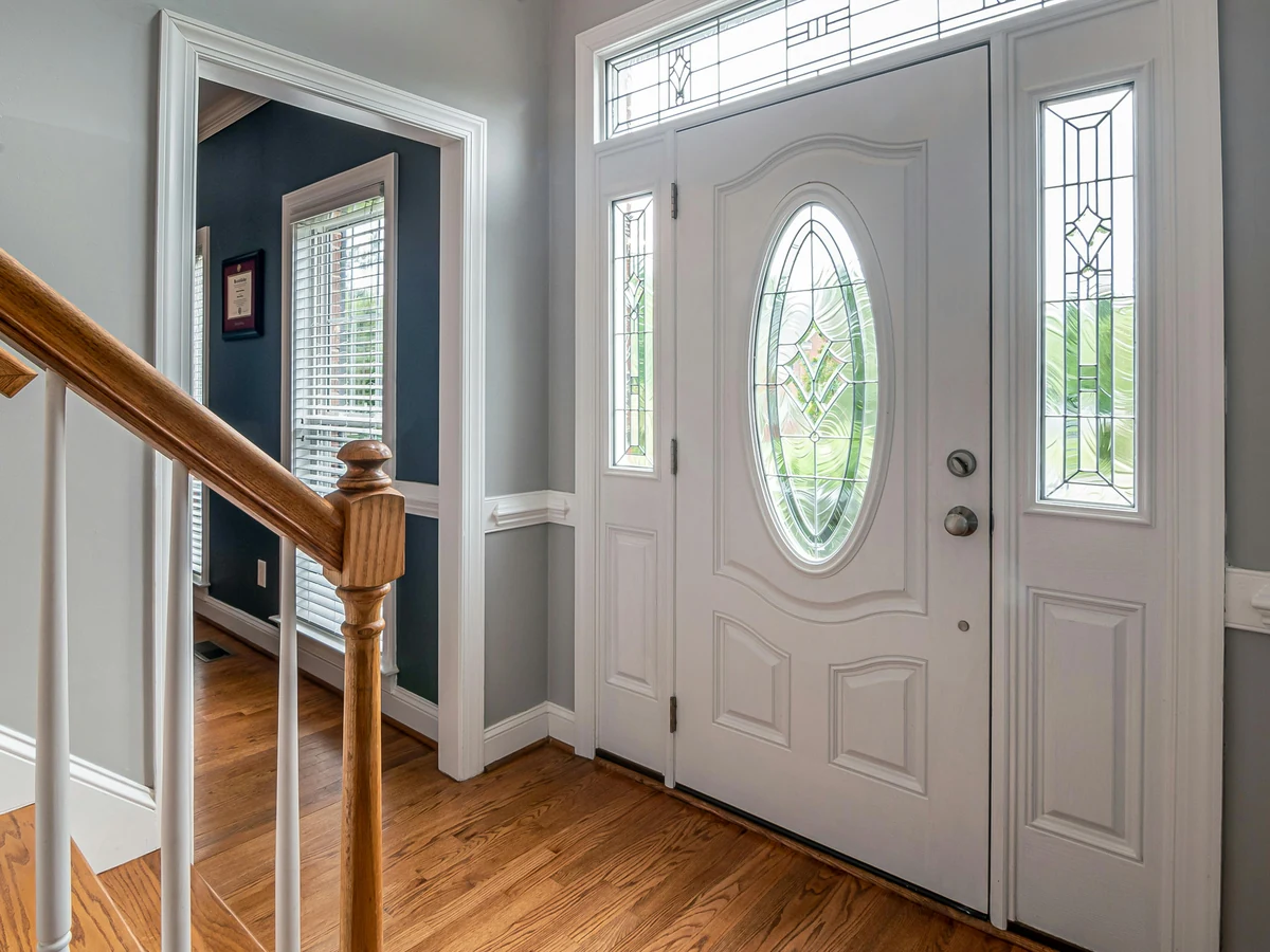 White entrance hallway with freshly painted doors in Hereford by Hereford Painters