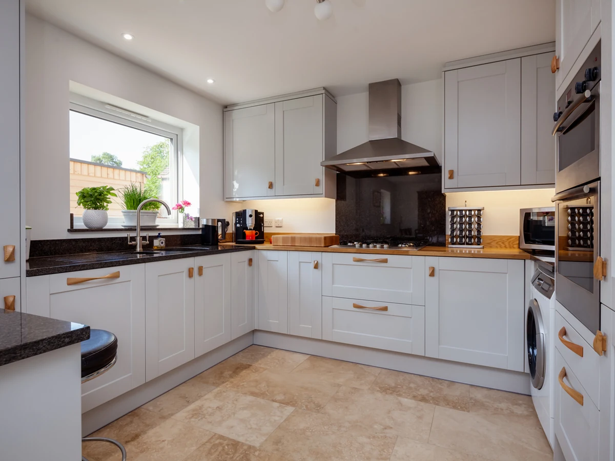 kitchen-painting-grey-shaker-style-hereford-painters Kitchen with grey shaker cabinets, a window and a tiled floor