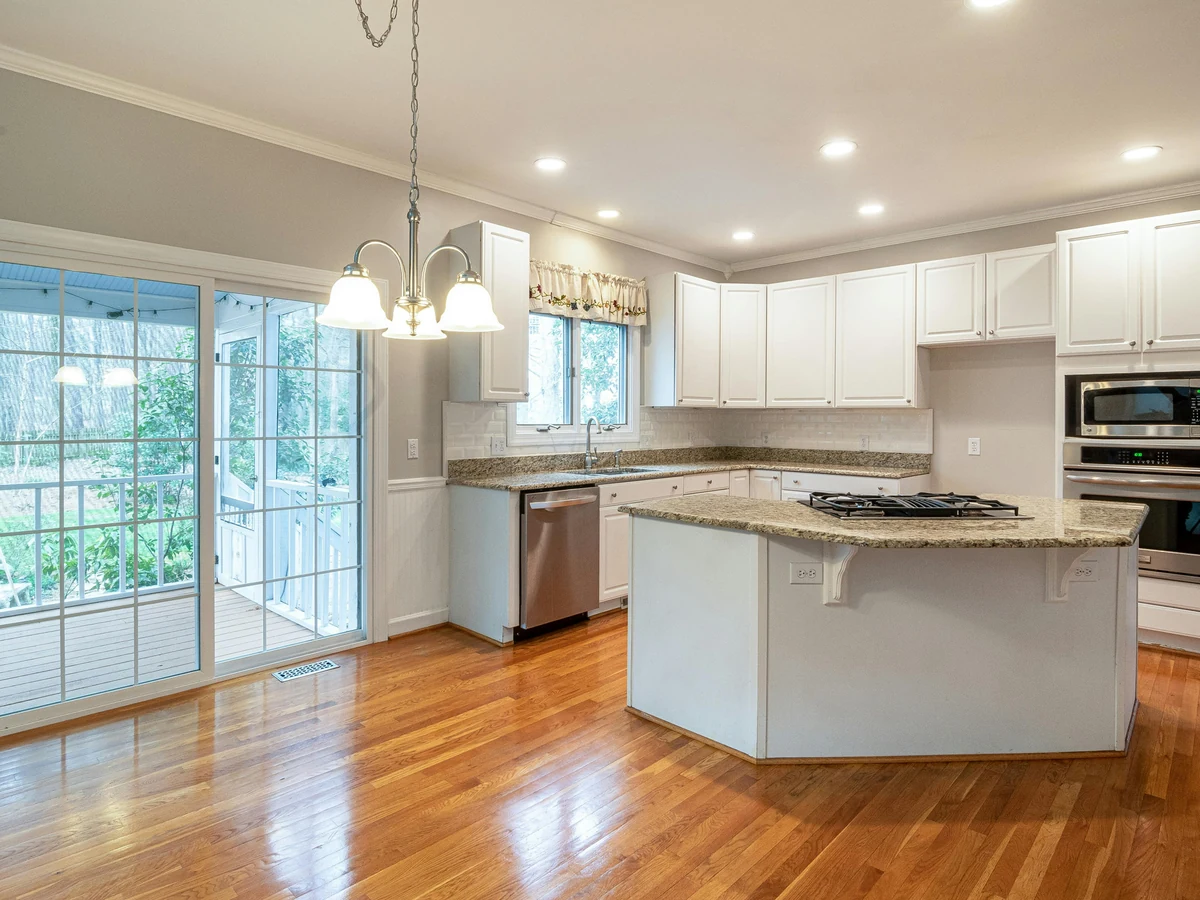 Kitchen cabinet painting in Hereford by Hereford Painters, white kitchen island with painted cabinets