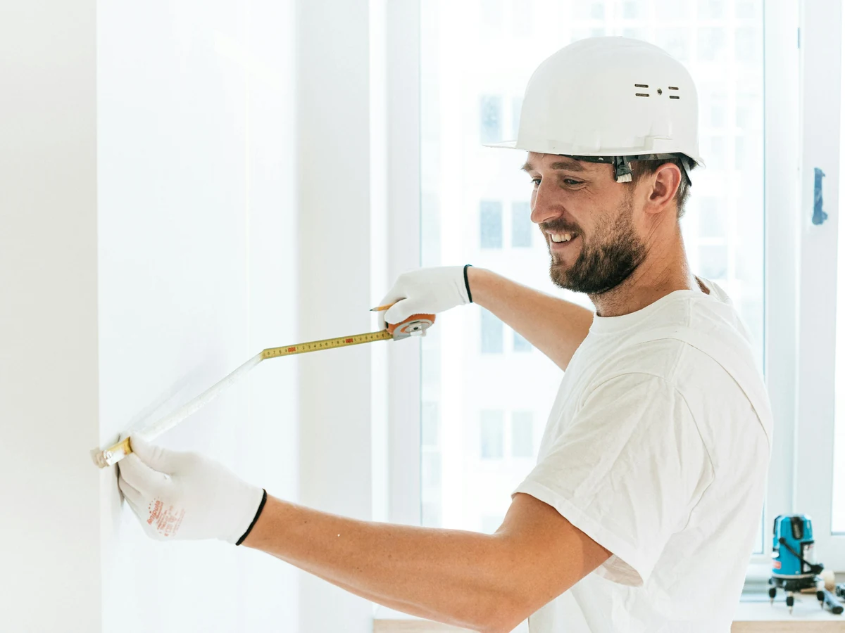 Painting and decorating tradesman in hard hat, Hereford Painters period property specialist