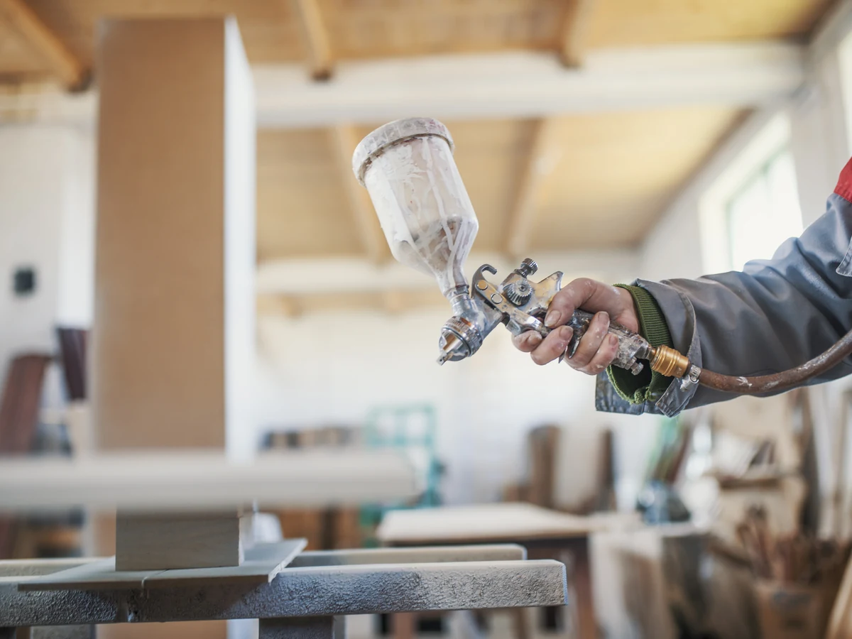 Hereford Painters worker spraying period property surfaces, professional finish